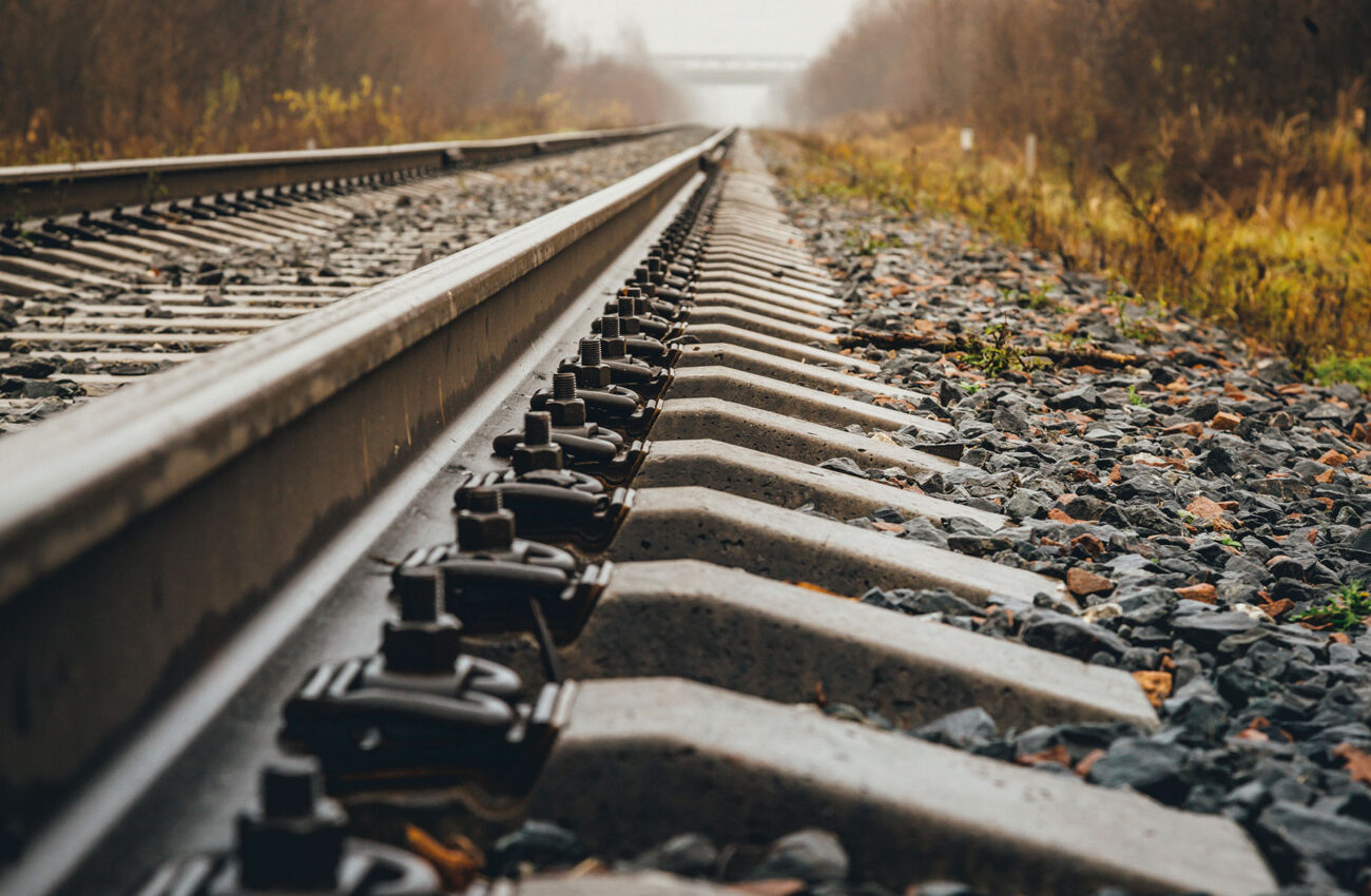 modern railway goes into foggy distance